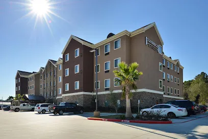 Logo of Staybridge Suites Tomball - Spring Area by IHG